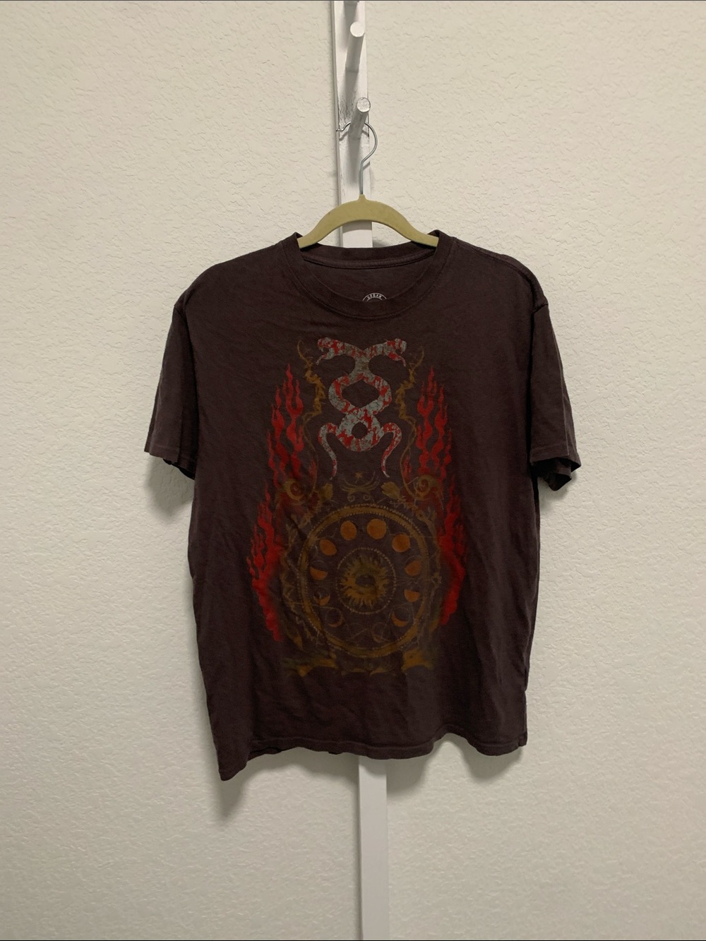 Urban Outfitters Brown Tee with Red Flame and Gold Medallion Graphic